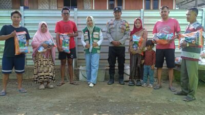 Dukung Ketahanan Pangan, Bhabinkamtibmas Desa Tapir Pendampingan Pembagian Bibit Jagung Kepada Kelompok Tani