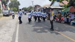 Polsek Kempo Amankan Lomba Gerak Jalan Indah HUT PGRI ke-81, Arus Lalu Lintas Tetap Terkendali